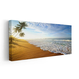 Ocean canvas wall art capturing palm trees and rolling waves.