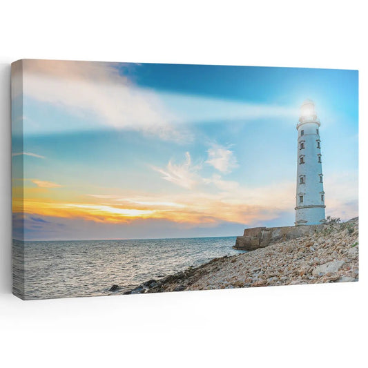 Coastal canvas wall art featuring a lighthouse with a glowing sunset.