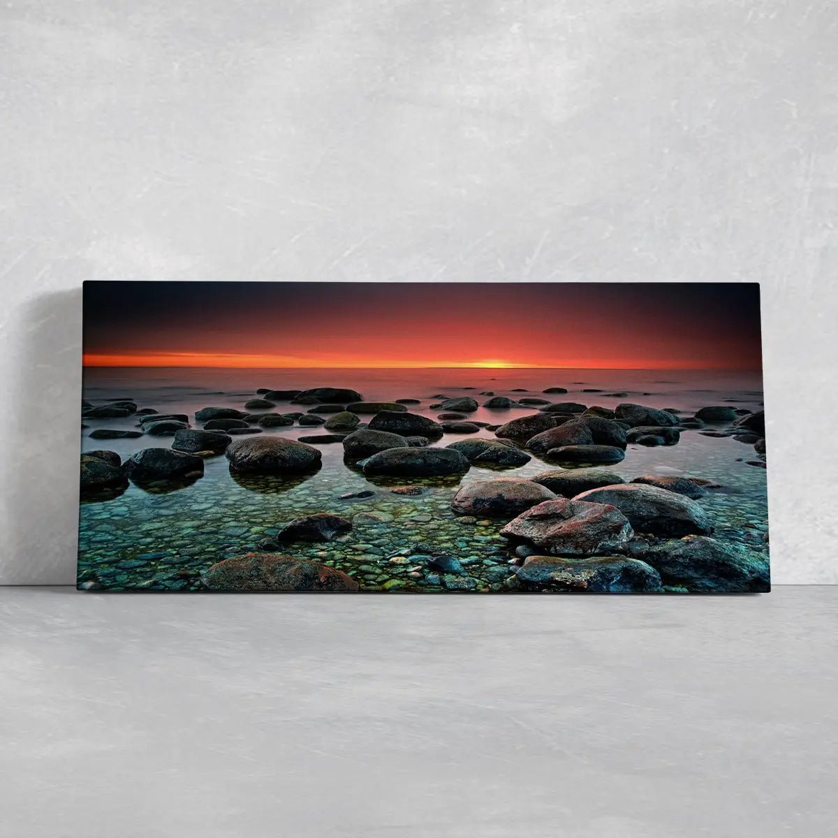 Relaxing ocean stone landscape at twilight for modern coastal home decor.