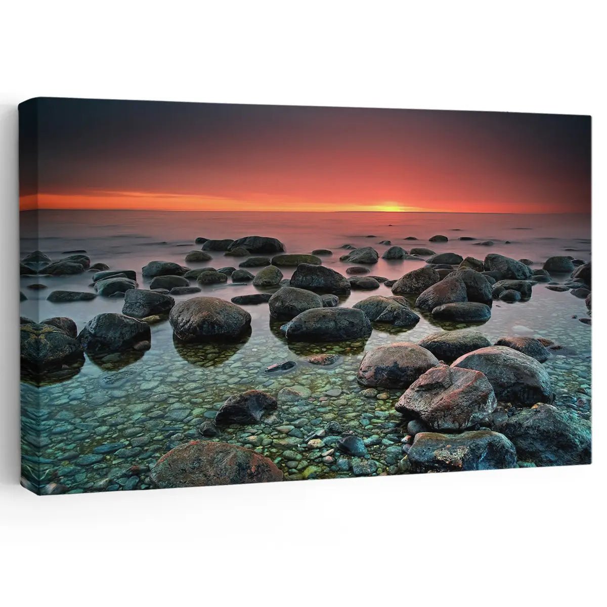 Tranquil rocky shoreline at sunset captured in a stunning coastal canvas print.