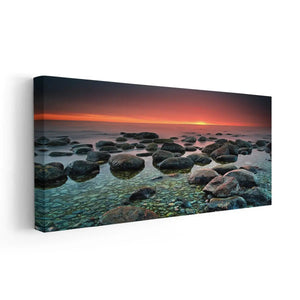 Large beach canvas print with misty water and textured natural rock formations.