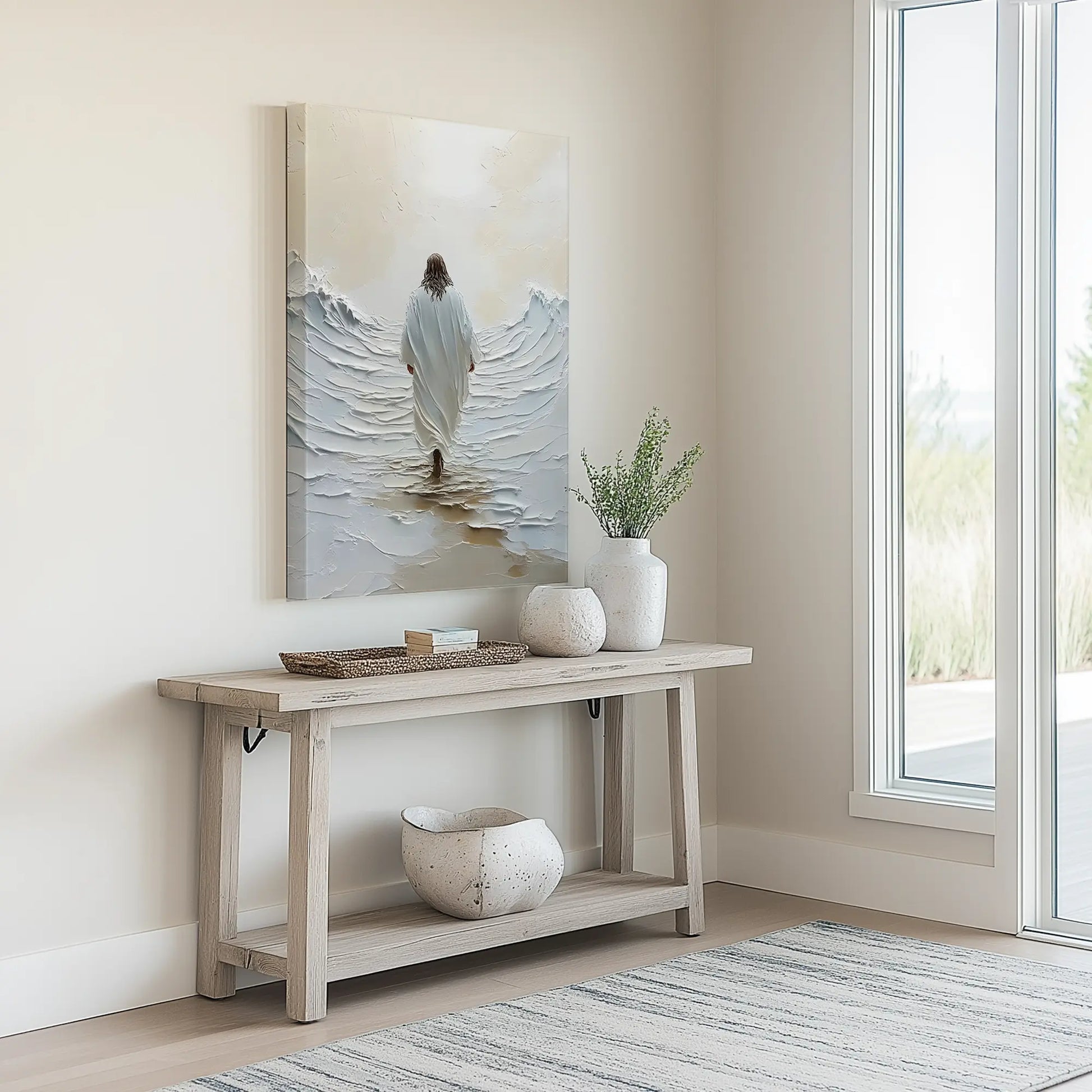 Modern Christian art of jesus walking on water in a minimalist entryway above a neutral console table, enhancing the welcoming ambiance.