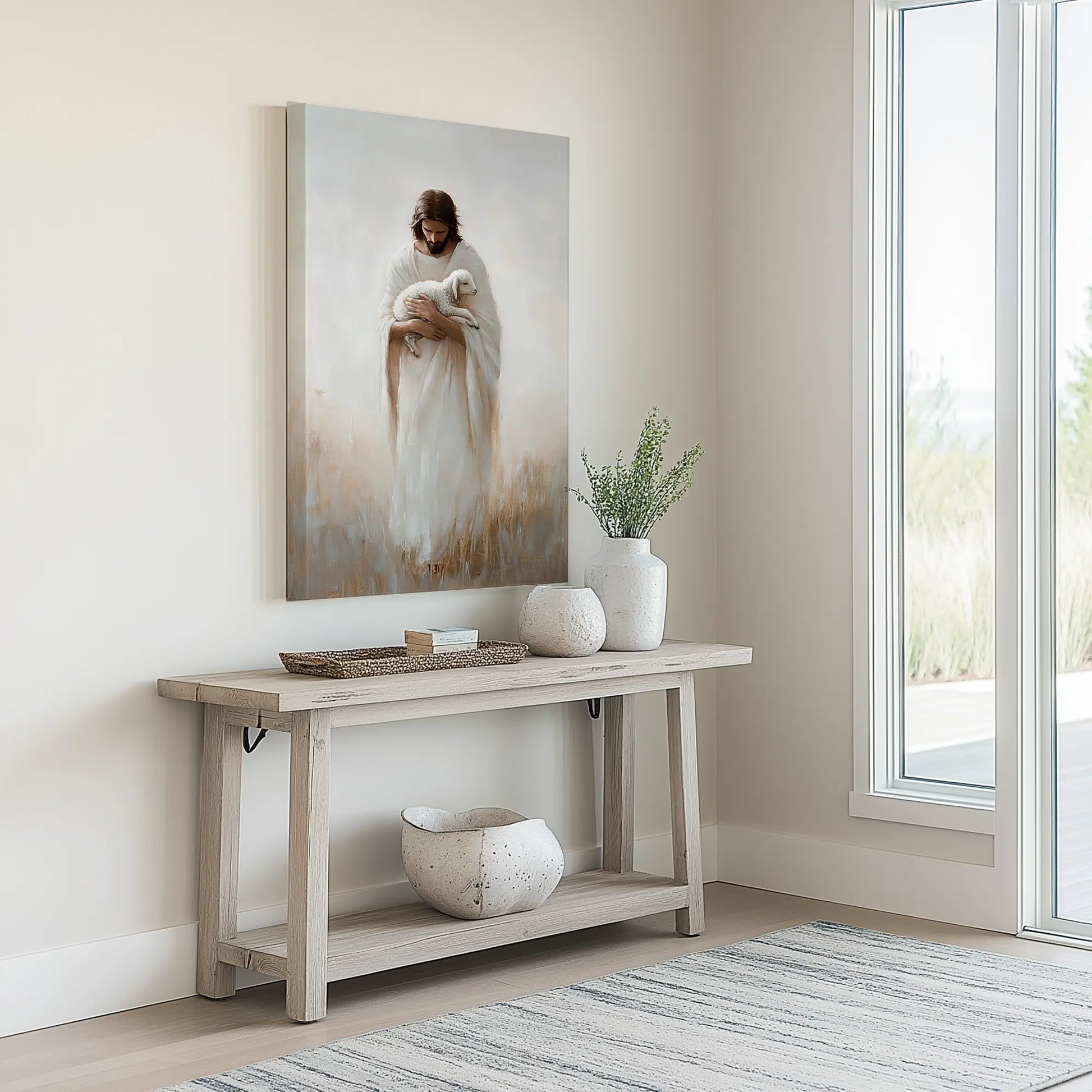 Modern Christian art of Jesus with a lamb in a minimalist entryway, placed above a neutral console table, enhancing warmth.