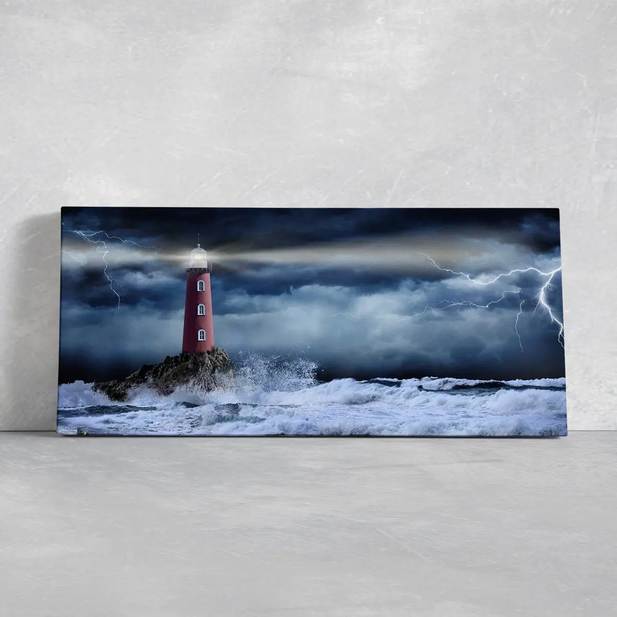 Coastal themed wall decor with a dramatic lighthouse landscape.