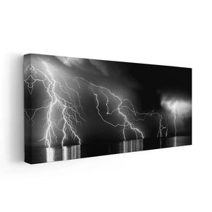 Seaside artwork portraying a storm’s raw beauty with glowing electric streaks.