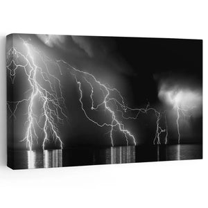 Abstract ocean wall art featuring an intense lightning storm over dark waters.