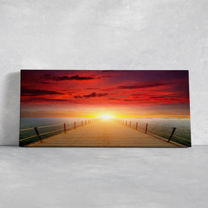 Ocean scene wall art with a breathtaking sunset and reflection on the water.