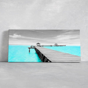 Coastal framed wall art displaying a peaceful seaside dock, ideal for coastal wall art for bedroom.