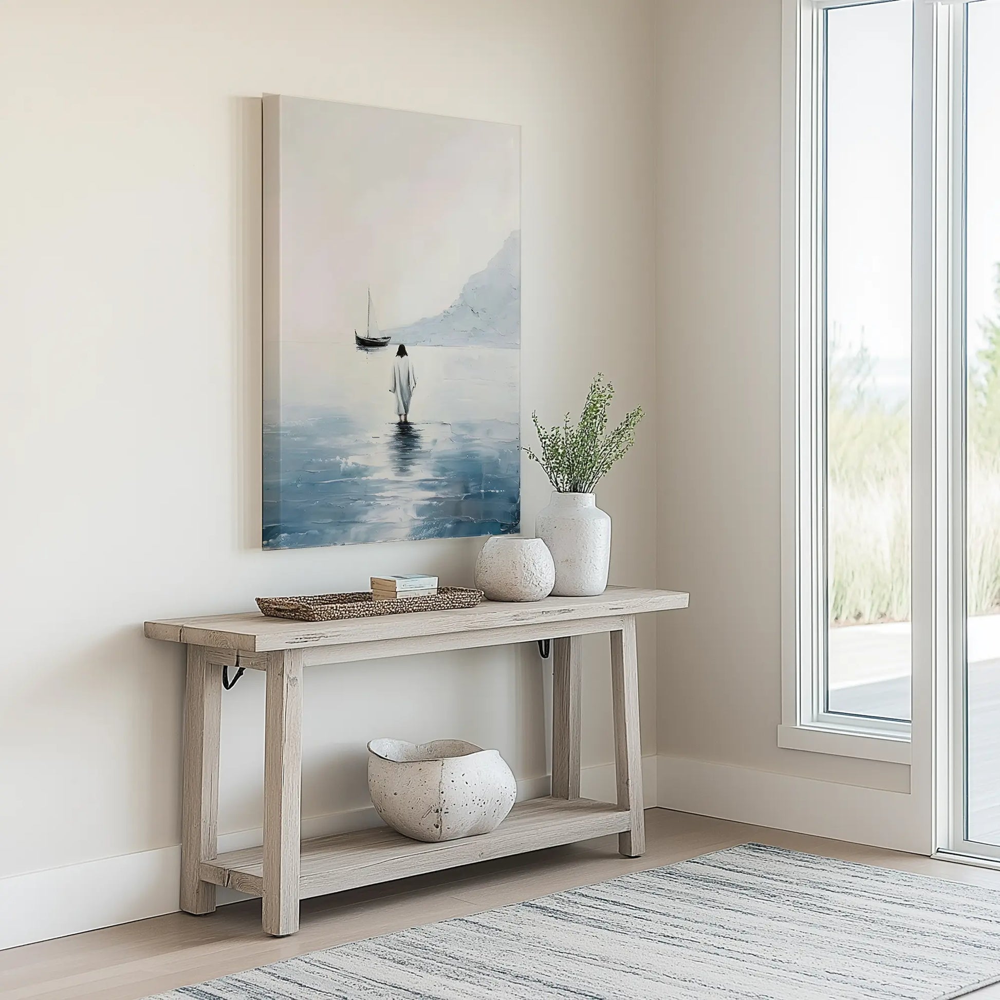 Modern Christian art of Jesus walking on water in a minimalist entryway above a neutral console table, enhancing the ambiance.