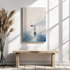 Religious art print of Jesus walking on water hung above a rustic bench, enhancing the minimalist Christian decor with inspiration.