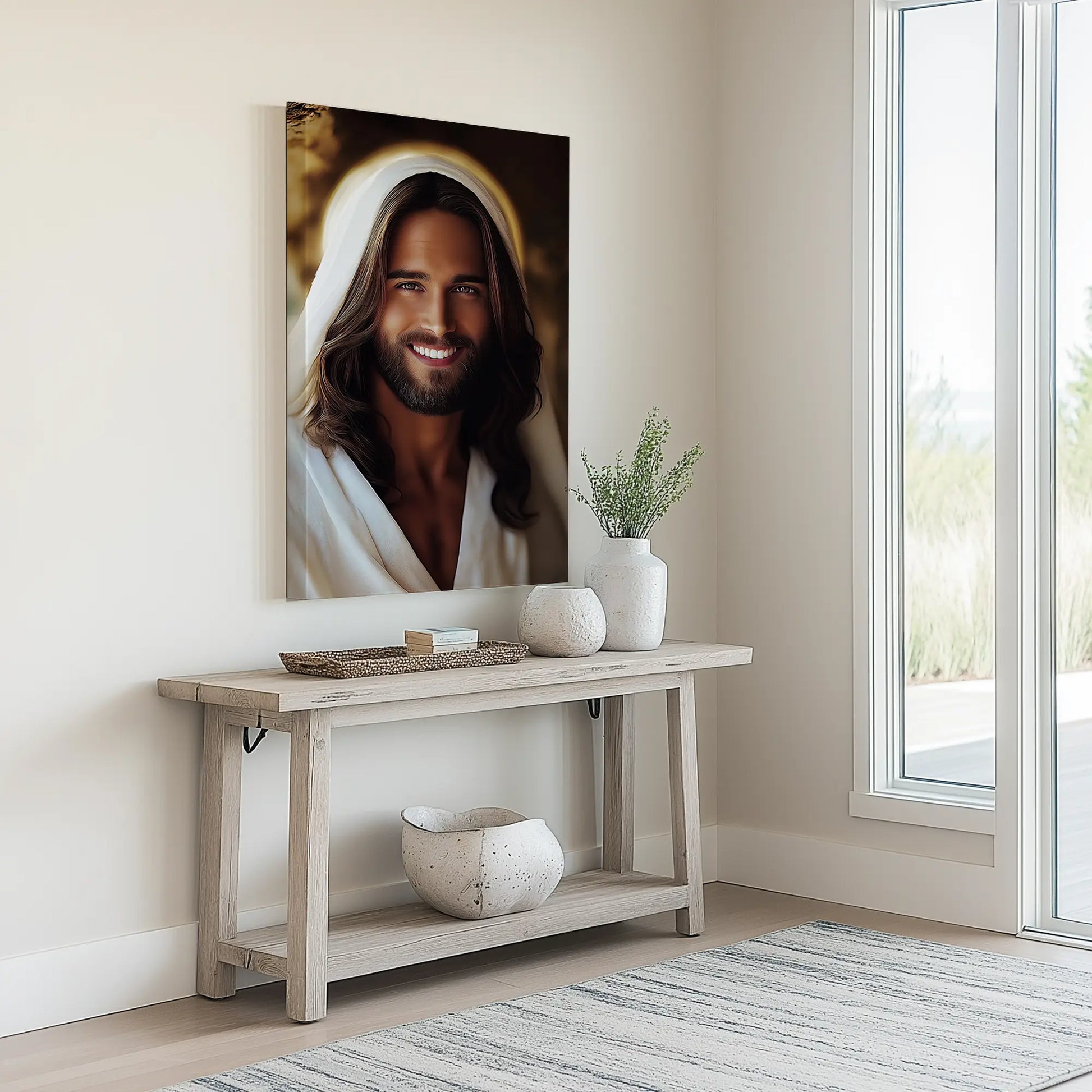 Modern Christian art of a smiling Jesus portrait in a minimalist entryway above a neutral console table, enhancing the space with warmth and welcome.