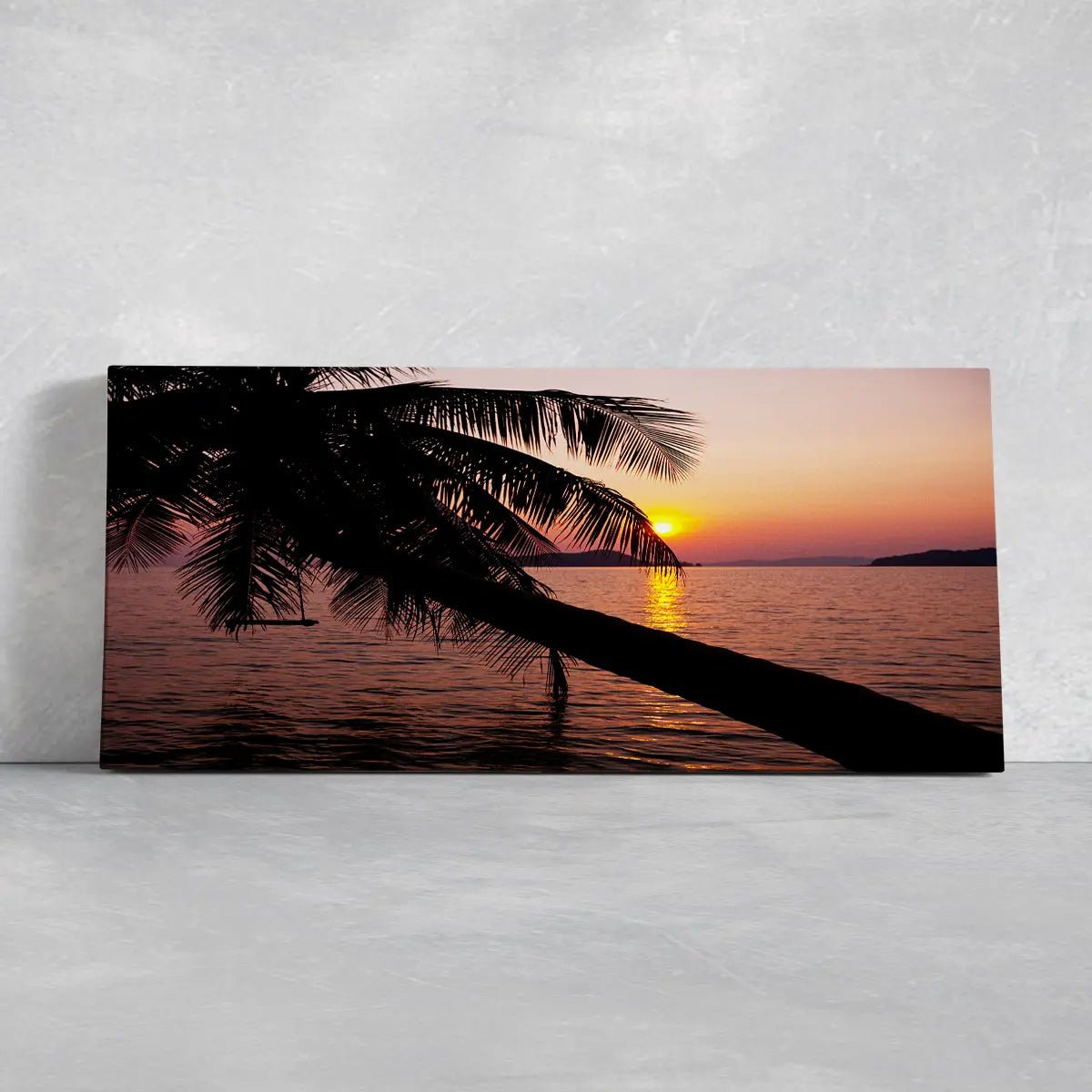 Large coastal canvas wall art highlighting a tropical beach with a palm tree silhouette against a colorful sky.