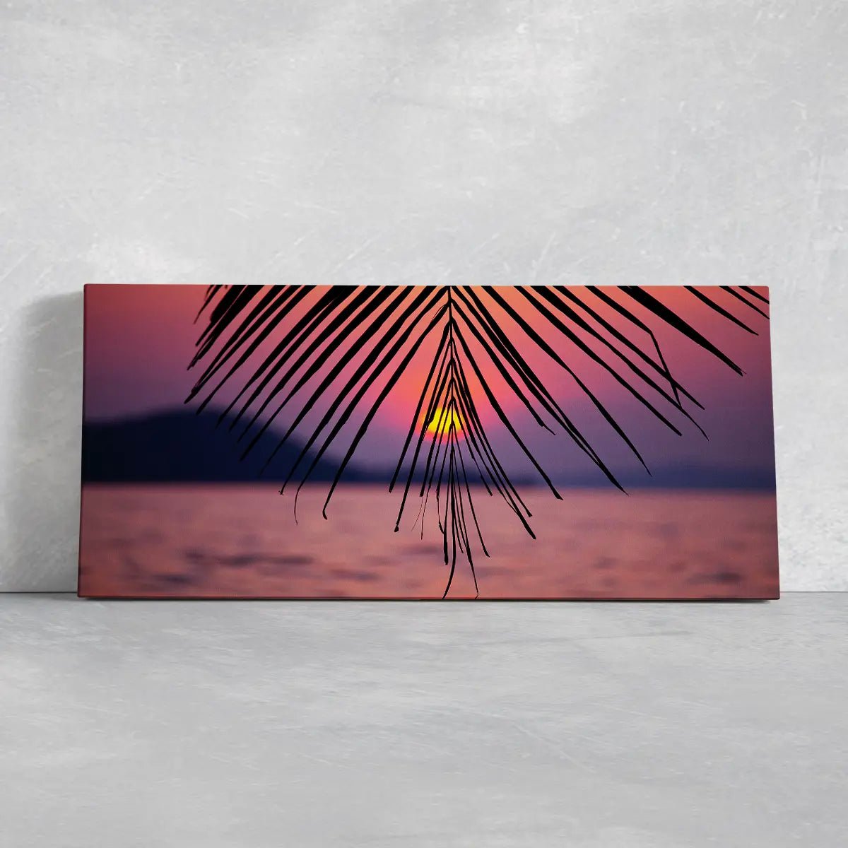 Large coastal canvas wall art highlighting a stunning palm tree sunset reflecting on the ocean horizon.