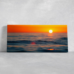 Sunset beach artwork highlighting ocean ripples in soft golden hues.