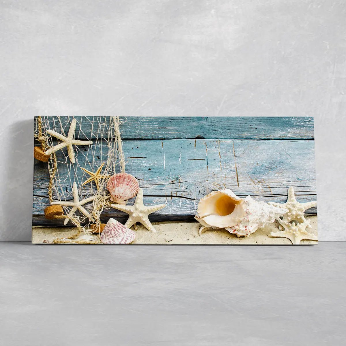 Coastal canvas prints showcasing starfish and seashells for a beach house.