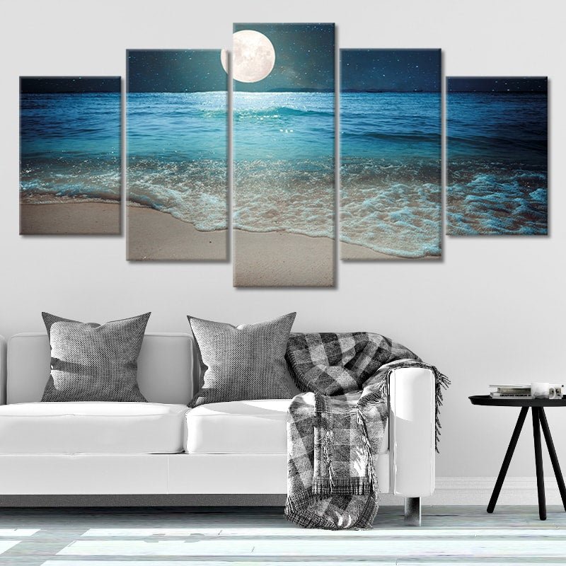 Coastal canvas prints of a moonlit beach with shimmering waves, a perfect addition to nautical and ocean-themed interiors.