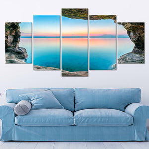 Beach wall art for living room featuring a dramatic sea cave opening to a serene ocean horizon.