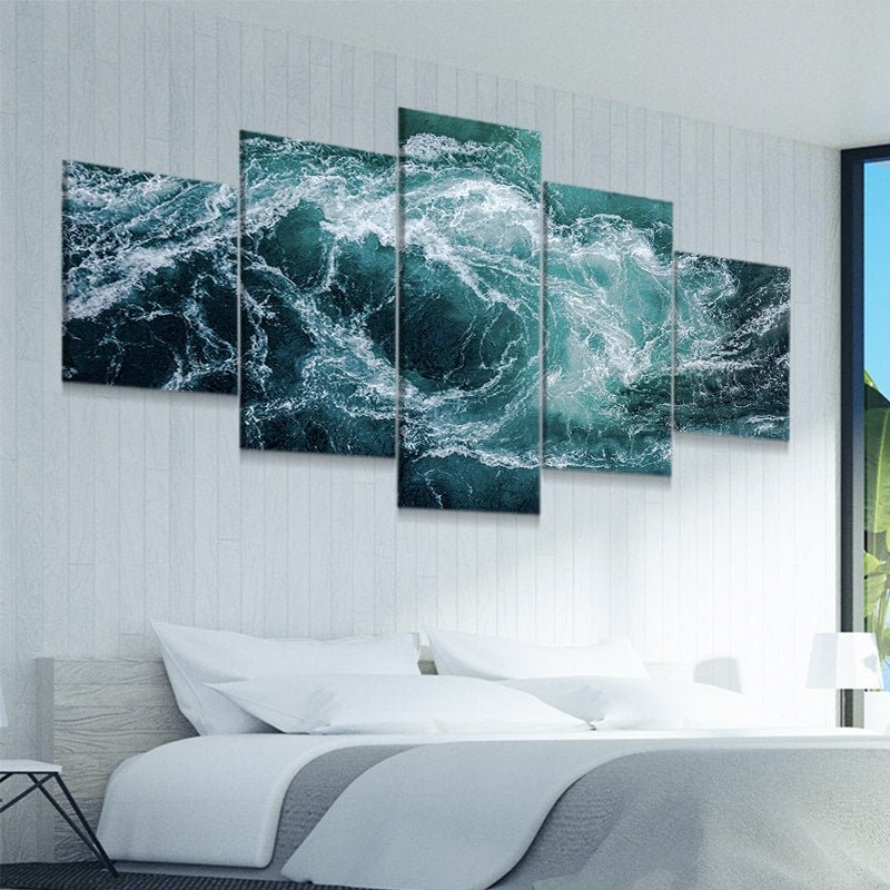 Coastal wall art framed to showcase deep blue ocean waves.