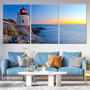 Extra large ocean wall art showcasing a historic lighthouse perched on rocky cliffs with a glowing sunset sky.