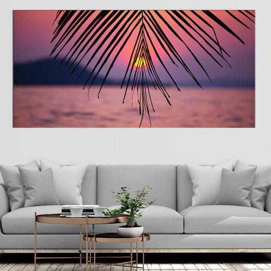  Extra large ocean wall art showcasing a tropical sunset with silhouetted palm fronds against a colorful sky.