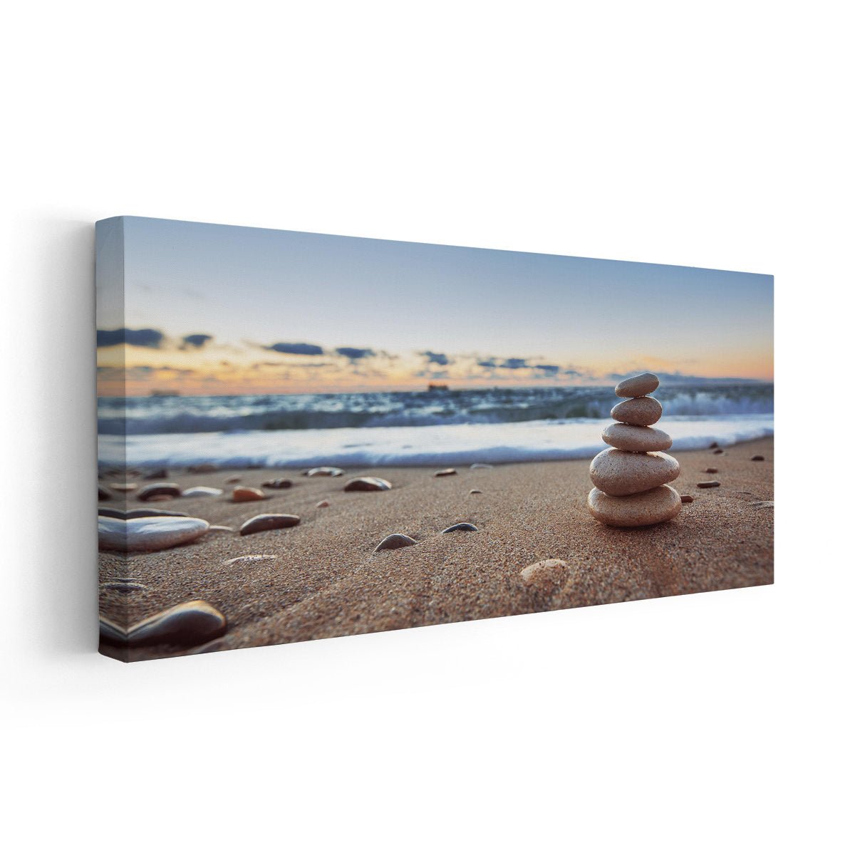  Large beach wall art featuring stacked stones on a sandy shore at sunset, perfect for a calming coastal decor.