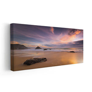 Large canvas beach wall art depicting a golden sunset over a peaceful beach with soft ocean waves.