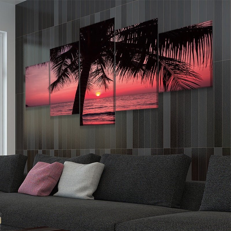 Large canvas beach wall art depicting a dramatic palm tree silhouette against a glowing red sunset.