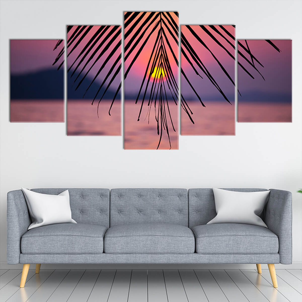 Large wall art ocean scene capturing a tropical sunset with palm tree silhouettes and a vibrant sky.